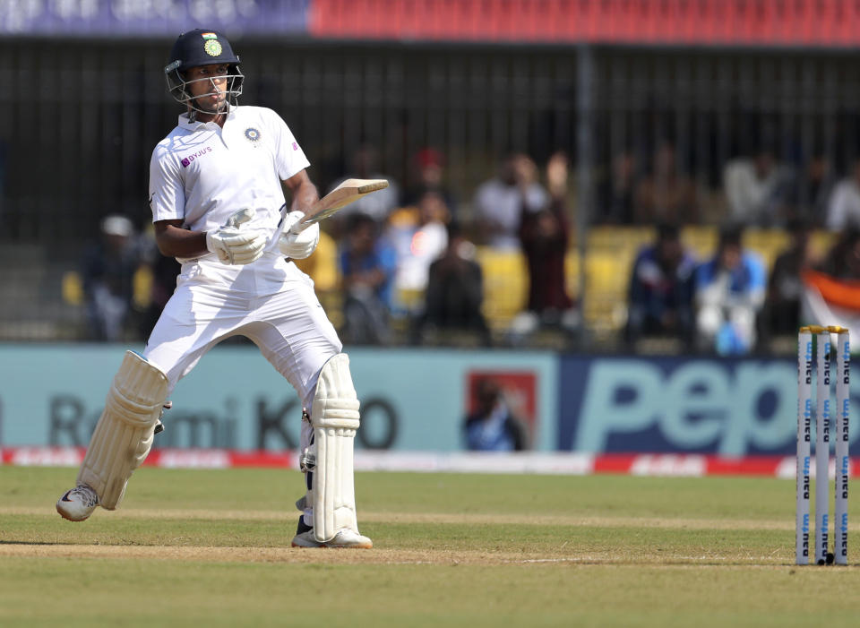 India's Mayank Agarwal watches the ball after playing a shot during the second day of first cricket test match between India and Bangladesh in Indore, India, Friday, Nov. 15, 2019. (AP Photo/Aijaz Rahi)