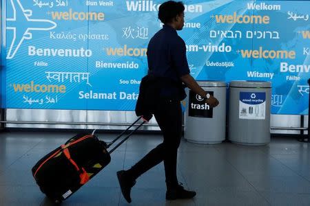 International travelers arrive at John F. Kennedy international airport in New York City, U.S., February 4, 2017. REUTERS/Brendan McDermid