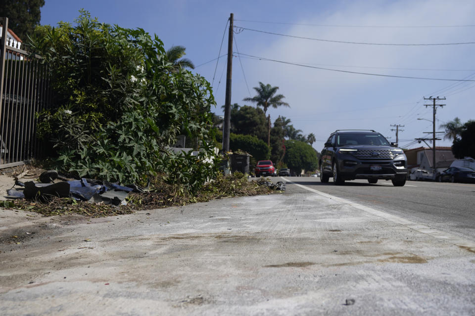 Debris is seen along the Pacific Coast Highway, Wednesday, Oct. 18, 2023, in Malibu, Calif. Tuesday. A 22-year-old driver was arrested on suspicion of manslaughter after a crash in Malibu killed four women, who are believed to be college students, and injured two others, officials said Wednesday. The six pedestrians were struck at about 8:30 p.m. Tuesday along Pacific Coast Highway about 4 miles (6.4 km) east of Pepperdine University, according to the Los Angeles County Sheriff's Department. (AP Photo/Ryan Sun)