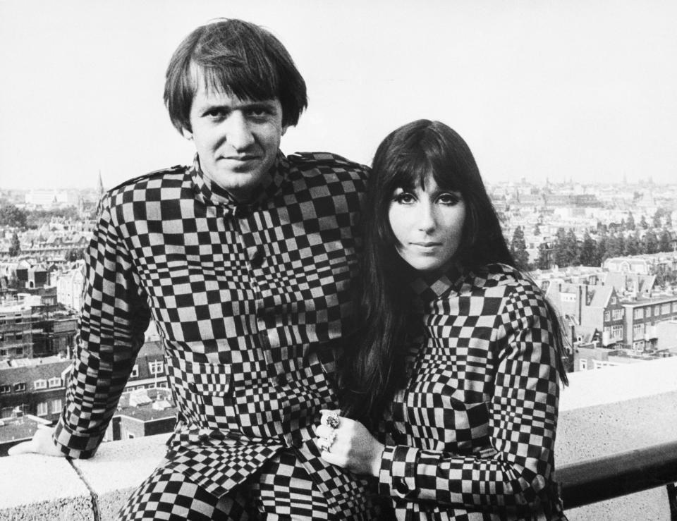 (Original Caption) 9/1966-Frankfurt, Germany- U.S. recording stars Sonny and Cher caused a stir in German fashion circles by sporting matching supermod suits (checker-board pattern), for both formal and informal wear. The husband and wife team, currently on a concert tour of Europe, continually face a problem of being refused admission to hotels and restaurants because of their unusual attire.