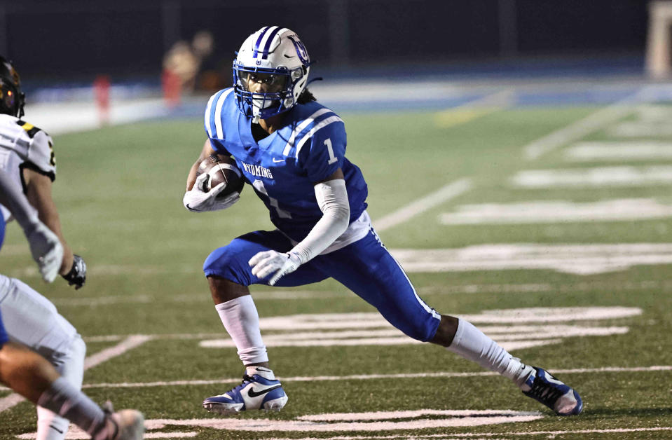 Wyoming running back D.J. Gray runs the ball during their 31-0 win over Taylor to extend their regular season win streak to 72, breaking a state record Friday, Sept. 15, 2023.