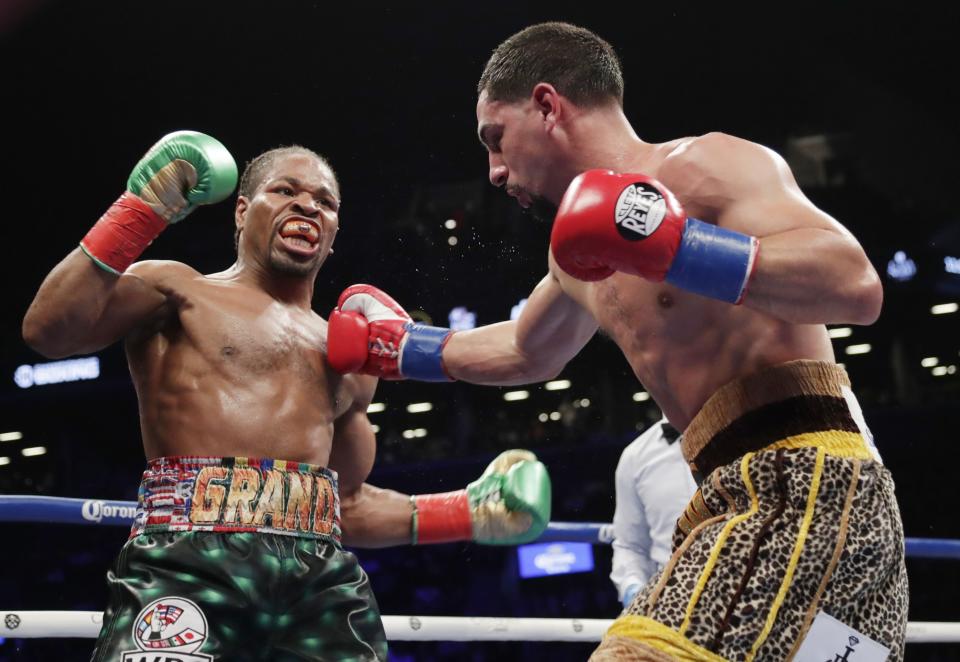 Shawn Porter (L) fights Danny Garcia during the seventh round of a WBC welterweight championship boxing match Saturday, Sept. 8, 2018, in New York. (AP Photo)