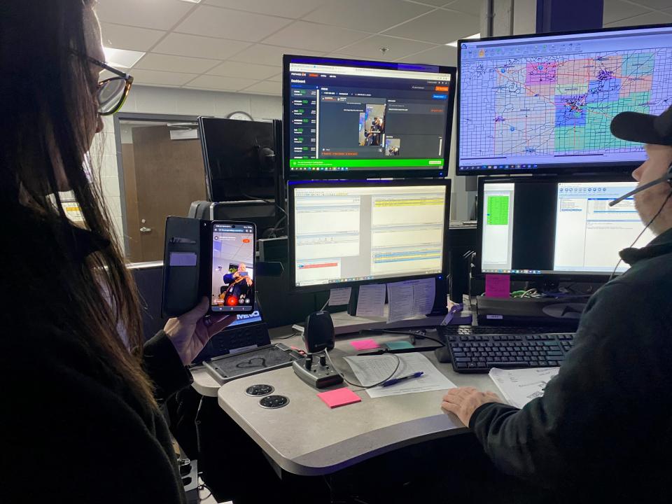 Sgt. Corrine Perdue, left, then deputy director of Lenawee County Central Dispatch, and dispatcher Adam Daggs demonstrate how a dispatcher can access a 911 caller's smartphone to view live video on Jan. 16. Lenawee County Central Dispatch is getting a piece of equipment that should help it to avoid some of the issues it has had with disruptions of 911 calls.