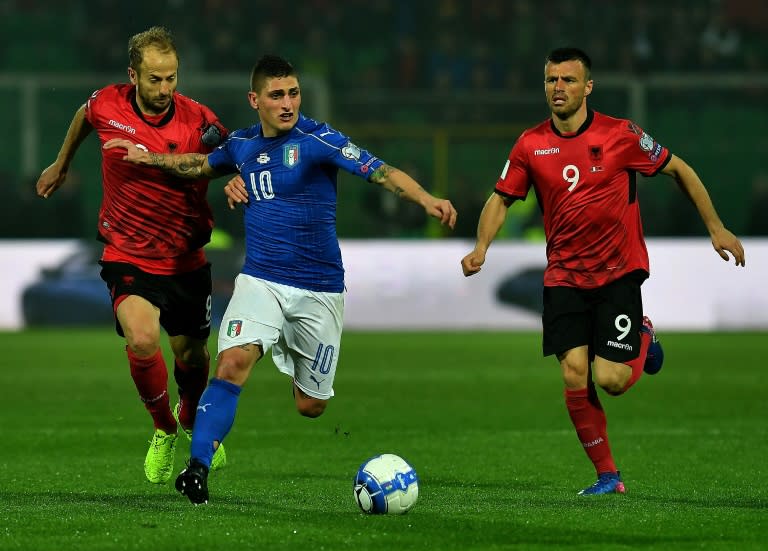 Italy's midfielder Marco Veratti (C) fights for the ball with Albania's defender Naser Aliji (L) and midfielder Ledian Memushaj during the FIFA World Cup 2018 qualification football match March 24, 2017