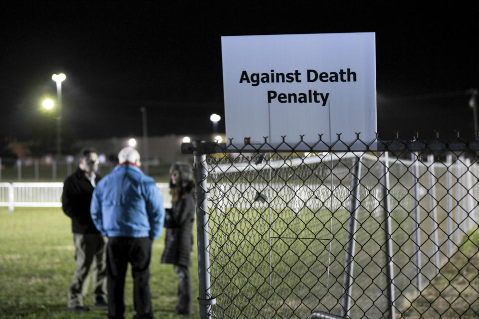 Protesters stood vigil outside the prison (AP)