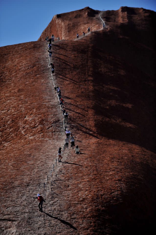 Tourists descend Uluru in 2010. Source: AAP