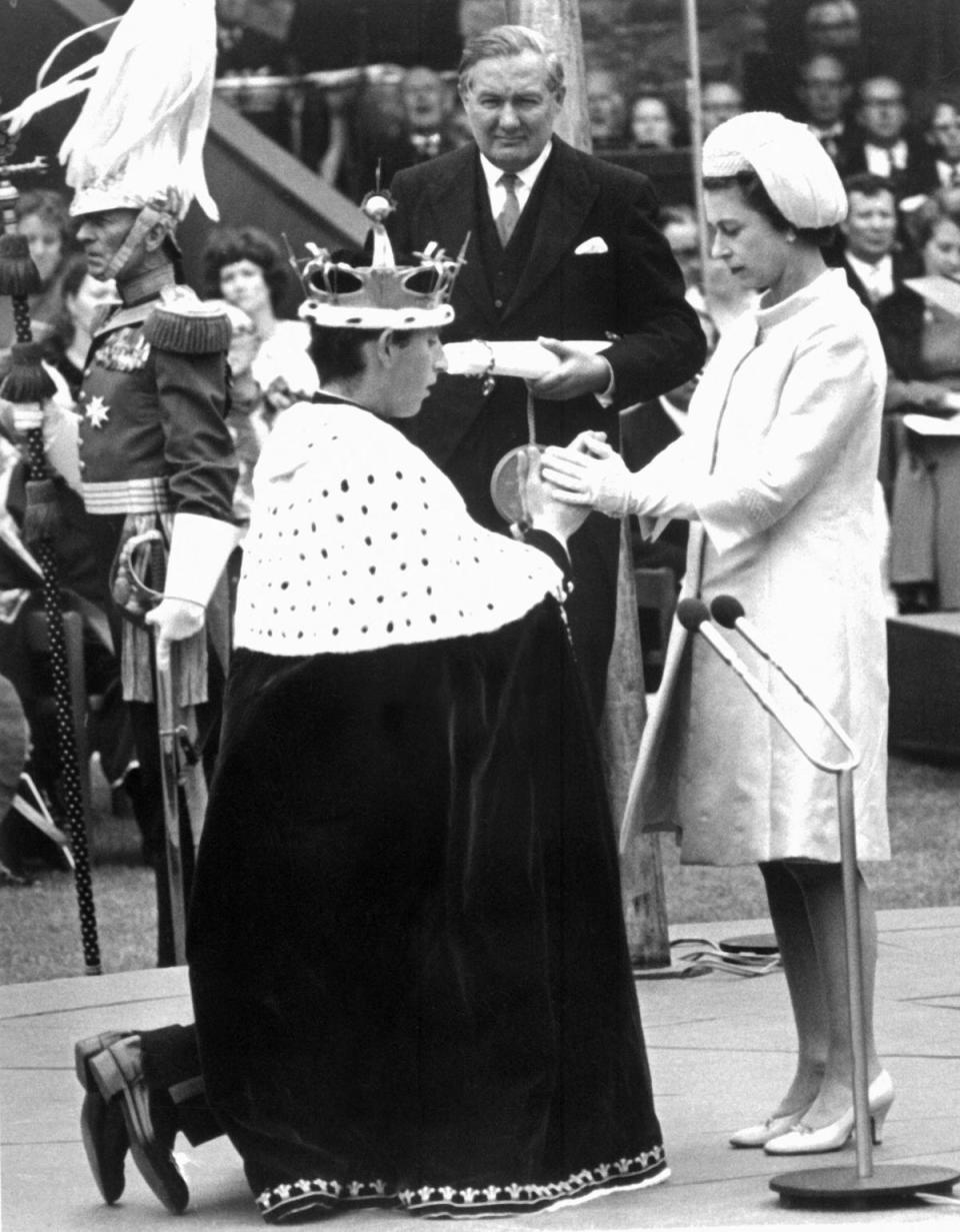 Charles knelt before his mother, Queen Elizabeth II, during his investiture as the Prince of Wales in 1969 (AFP via Getty Images)