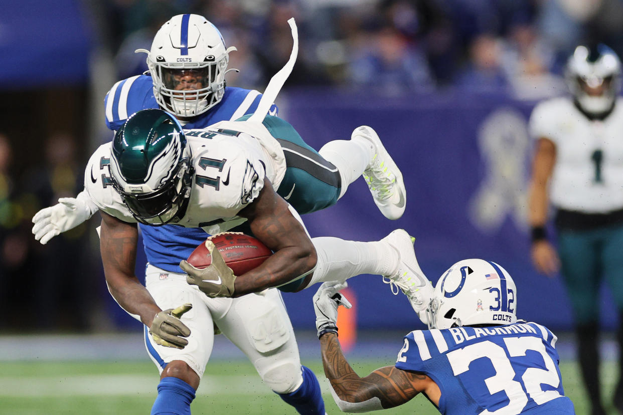 AJ Brown of the Philadelphia Eagles flies through the air after being hit by Julian Blackmon of the Colts. (Photo by Andy Lyons/Getty Images)