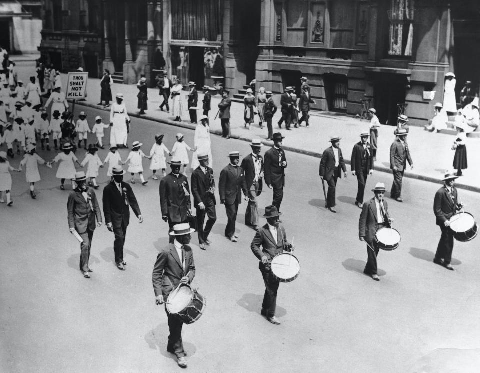 W.E.B. Du Bois, third from right in the second row, joins other marchers in New York protesting against racism on July 28, 1917. <a href="https://www.gettyimages.com/detail/news-photo/prominent-african-americans-residents-of-the-city-paraded-news-photo/530843082?phrase=web%20du%20bois&adppopup=true" rel="nofollow noopener" target="_blank" data-ylk="slk:George Rinhart/Corbis via Getty Images;elm:context_link;itc:0;sec:content-canvas" class="link ">George Rinhart/Corbis via Getty Images</a>