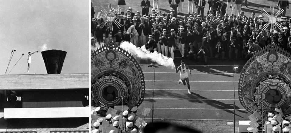 Japanese runner Yoshinori Sakai runs with the Olympic torch to light the cauldron, right, during the opening ceremonies of the Summer Olympics in Tokyo, Oct. 10, 1964. (AP Photo)