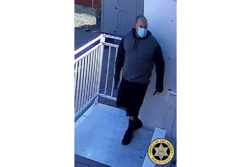 This undated image released by Merced County Sheriff’s Office shows a person of interest outside the kidnapped family’s business (Merced County Sheriff’s Office)