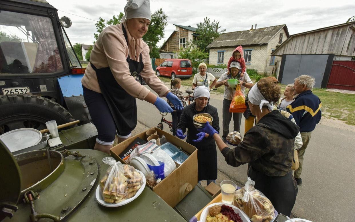 Food aid is delivered to residents in Novoselivka village, in the Chernihiv region – Putin’s invasion of Ukraine is guaranteed to cause a two-year food crisis, Western officials warn - OLEG PETRASYUK/EPA-EFE/Shutterstock