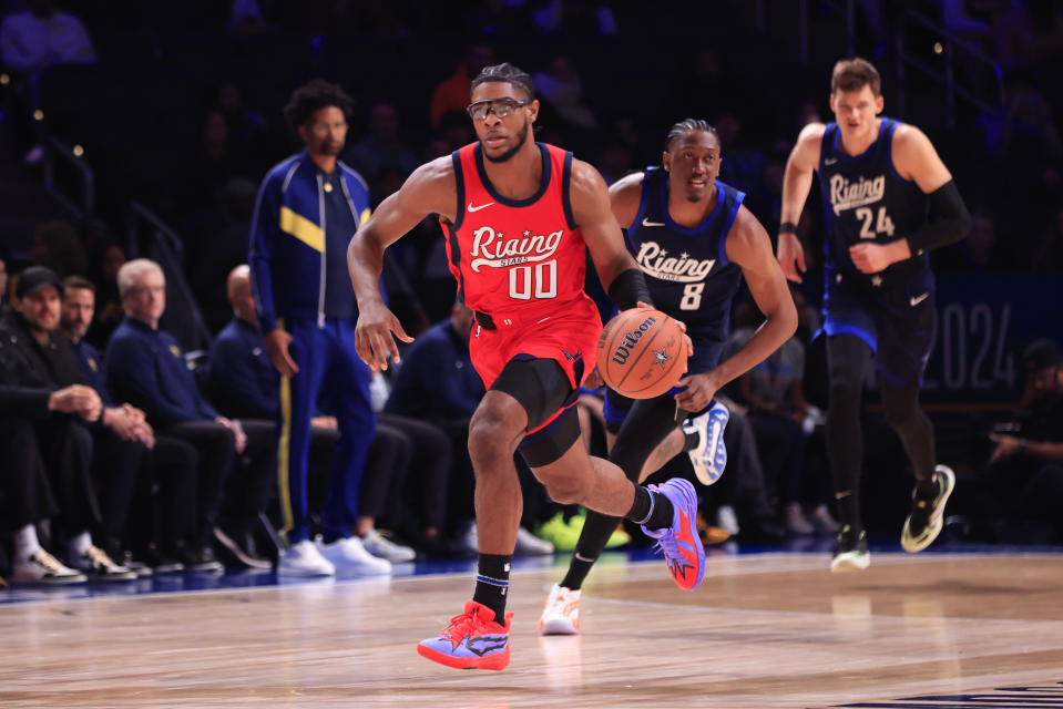 INDIANAPOLIS, INDIANA - FEBRUARY 16: Scoot Henderson #00 of the Portland Trail Blazers  brings the ball up the court during the first game of the Panini Rising Stars at Gainbridge Fieldhouse on February 16, 2024 in Indianapolis, Indiana. NOTE TO USER: User expressly acknowledges and agrees that, by downloading and or using this photograph, User is consenting to the terms and conditions of the Getty Images License Agreement. (Photo by Justin Casterline/Getty Images)