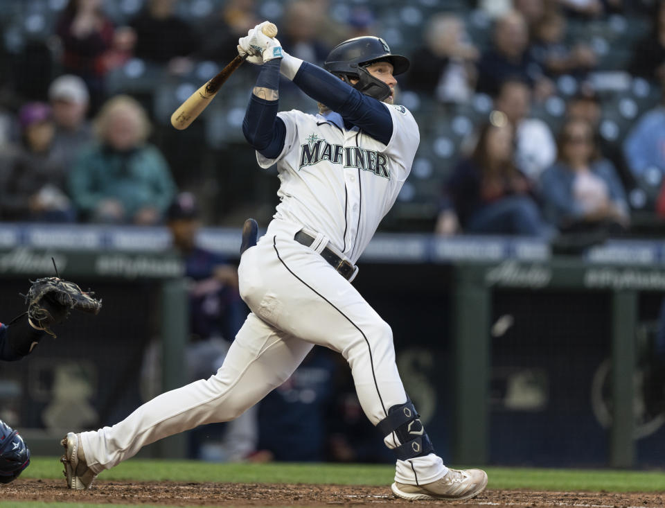 Seattle Mariners' Jake Fraley watches his RBI single off of Minnesota Twins starting pitcher J.A. Happ during the fourth inning of a baseball game Tuesday, June 15, 2021, in Seattle. (AP Photo/Stephen Brashear)