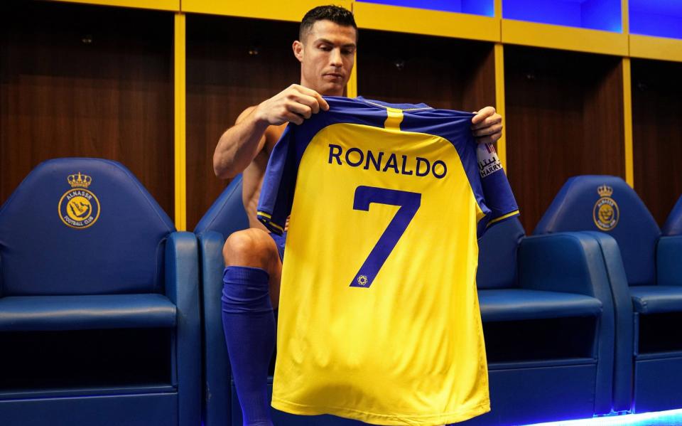 Ronaldo with his new shirt - AL-NASSR CLUB/EPA-EFE/Shutterstock HANDOUT