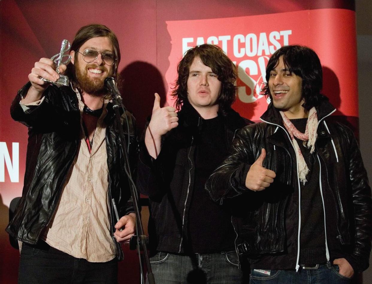 Jay Smith (centre) helped grow the rock music scene on Cape Breton early in his career, before joining bands like Matt Mays and El Torpedo. This photo was taken at the 2009 East Coast Music Awards. (Jacques Boissinot/The Canadian Press - image credit)