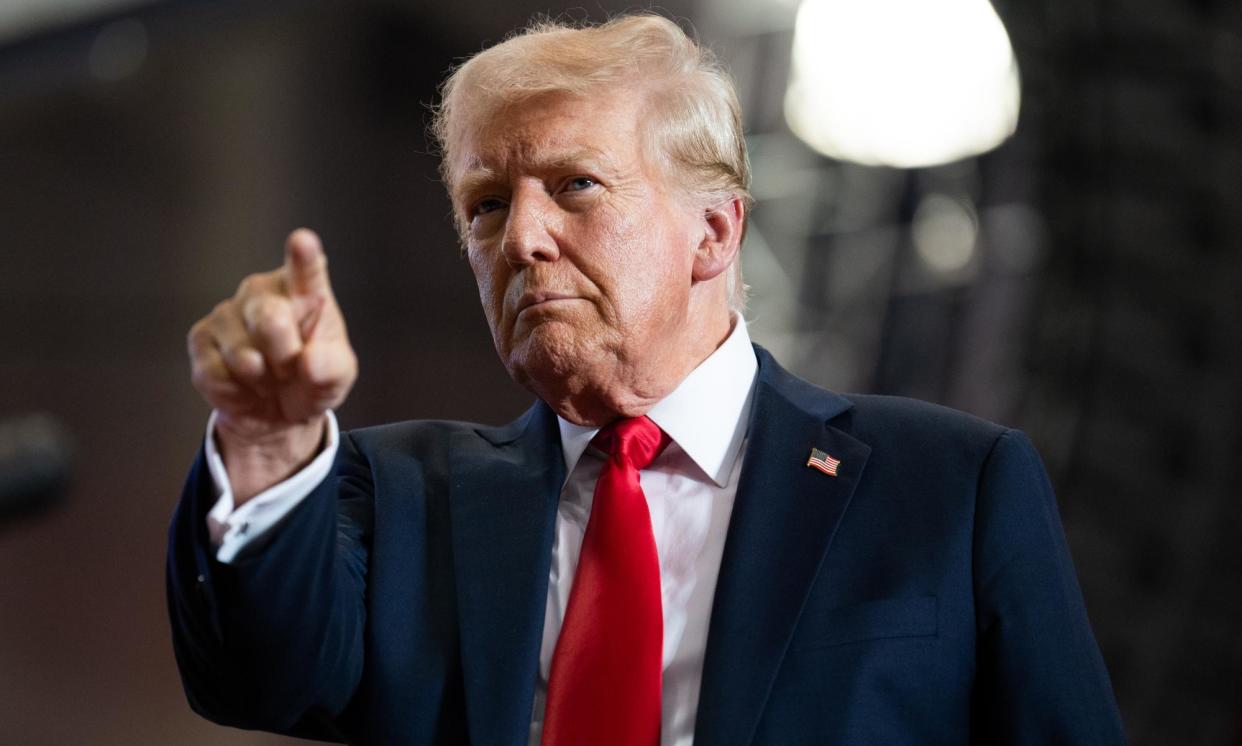 <span>Donald Trump arrives to speak in St Cloud, Minnesota, on Friday.</span><span>Photograph: Stephen Maturen/Getty Images</span>