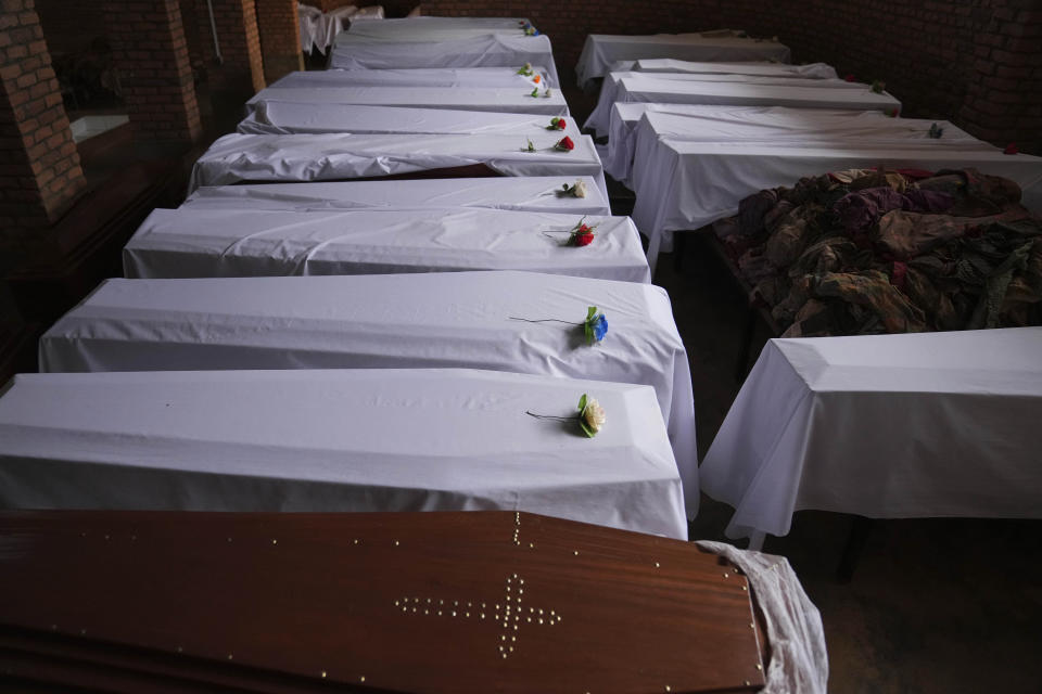 Coffins containing newly discovered remains of victims of the 1994 genocide arranged before a funeral ceremony, in a Catholic church, in Nyamata, Rwanda, Friday, April 5, 2024. An estimated 800,000 Tutsis were killed by extremist Hutus in massacres that lasted over 100 days in 1994. Some moderate Hutu who tried to protect members of the Tutsi minority were also targeted. (AP Photo/Brian Inganga)