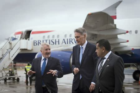 (Left-right) Declan Collier CEO of London City Airport, Chancellor Philip Hammond and Minister for Aviation Lord Ahmad during a visit to London City Airport, Britain July 27, 2016. REUTERS/Stefan Rousseau/Pool