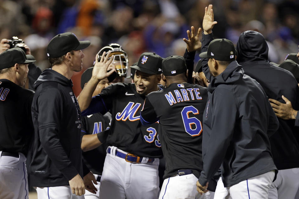 New York Mets pitcher Edwin Diaz (39) celebrates with teammates after a baseball game against the Philadelphia Phillies on Friday, April 29, 2022, in New York. The Mets won 3-0 on a combined no-hitter. (AP Photo/Adam Hunger)