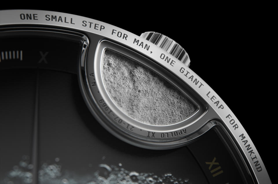 a close-up photo of an analog watch's face, showing the inscripition 