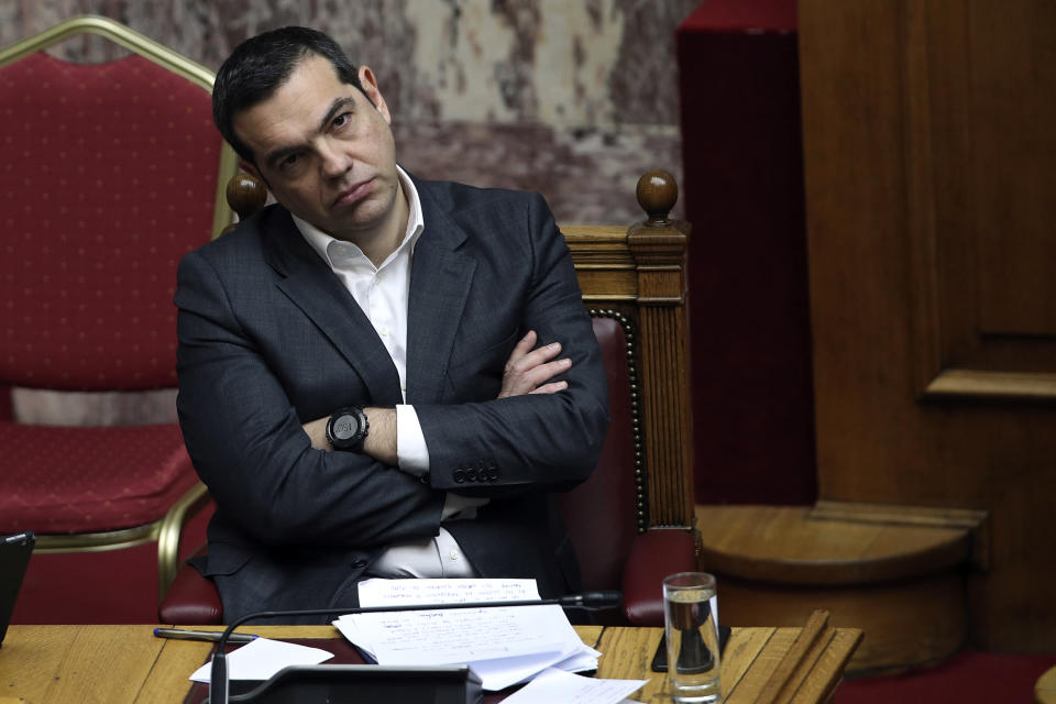 Greek Prime Minister Alexis Tsipras attends a parliamentary session in Athens, on Tuesday, Jan. 15, 2019. Greece's prime minister is defending his deal to normalize relations with neighboring Macedonia ahead of a confidence vote in parliament after his governing coalition collapsed over the agreement. (AP Photo/Petros Giannakouris)