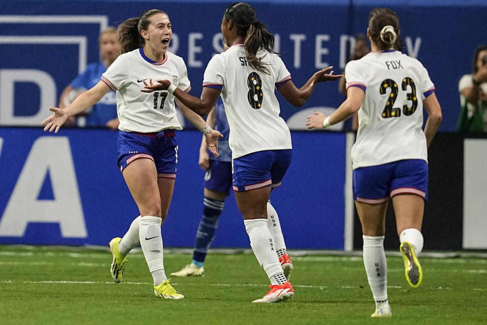 United States' Jaedyn Shaw (8) celebrates her goal on an assist from Sam Coffey (17) during the first half against Japan in the SheBelieves Cup women’s soccer tournament, Saturday, April 6, 2024, in Atlanta. (AP Photo/Mike Stewart)