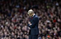 Arsenal's manager Arsene Wenger reacts during their Champions League soccer match against Borussia Dortmund at the Emirates stadium in London October 22, 2013. REUTERS/Dylan Martinez (BRITAIN - Tags: SPORT SOCCER)