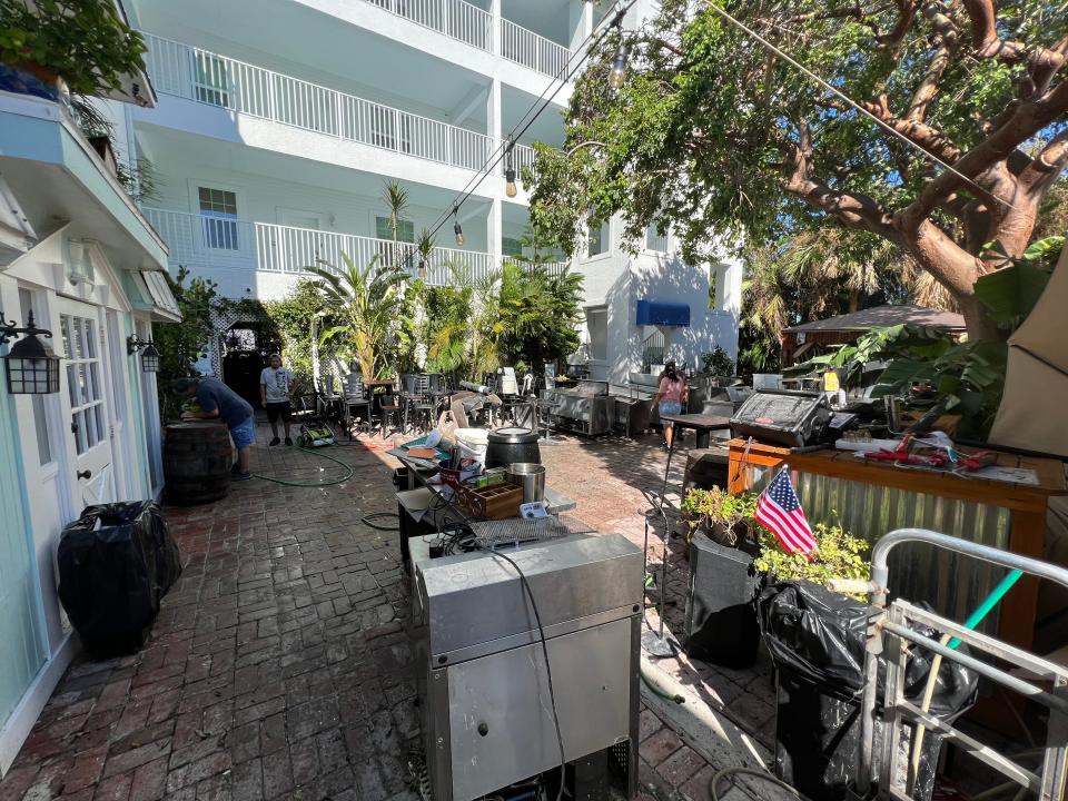 Equipment from the Boardroom Tavern in Marco Island sits out in the courtyard on Oct. 1 after getting hit with Hurricane Ian's storm surge.