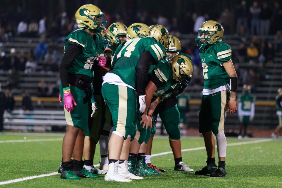 GNB Voc Tech’s Cam Lynch gives the offense the play call during the State Vocational Large semifinal against Assabet.