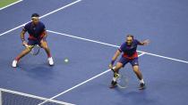 Robert Farah, and Juan Sebastian Cabal, both of Colombia, return a shot to Marcel Granollers, of Spain, and Horacio Zeballos during the final match of the U.S. Open tennis championships Friday, Sept. 6, 2019, in New York. (AP Photo/Sarah Stier)