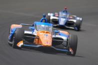 Scott Dixon, of New Zealand, leads Alex Palou, of Spain, through the first turn during practice for the Indianapolis 500 auto race at Indianapolis Motor Speedway in Indianapolis, Thursday, May 18, 2023. (AP Photo/Michael Conroy)