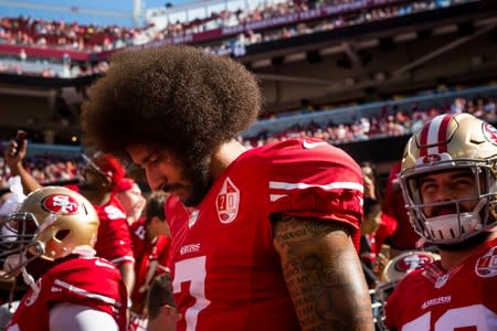 FILE PHOTO: San Francisco 49ers quarterback Colin Kaepernick prepares to take the field before an NFL game against the Tampa Bay Buccaneers at Levi's Stadium in Santa Clara