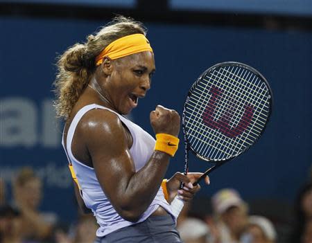 Serena Williams of the U.S. reacts as she defeats Maria Sharapova of Russia during their women's singles semi-finals match at the Brisbane International tennis tournament in Brisbane, January 3, 2014. REUTERS/Jason Reed