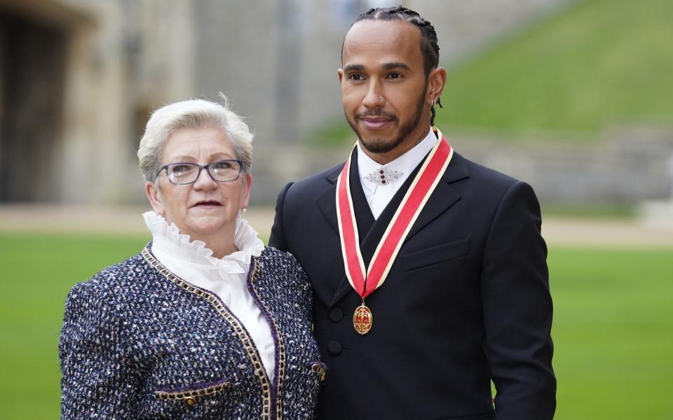 Sir Lewis Hamilton with his mother Carmen Lockhart after he was made a Knight - PA