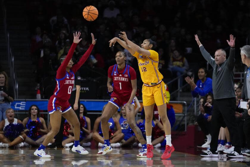 Southern California guard JuJu Watkins (12) passes against Kansas guard Wyvette Mayberry.