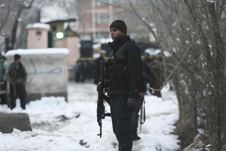 Security personnel stand guard at the site of a suicide attack on the Supreme Court in Kabul, Afghanistan, Tuesday, Feb. 7, 2017. A suicide bomber on Tuesday targeted the Supreme Court building in the Afghan capital, Kabul, killing over a dozen people, officials said. (AP Photo/Rahmat Gul)