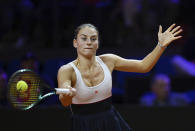 Ukraine’s Marta Kostyuk hits a return during a semifinal match against Marketa Vondrousova at the Porsche Grand Prix tennis tournament, Saturday, April 20, 2024, in Stuttgart, Germany. (Marijan Murat/dpa via AP)