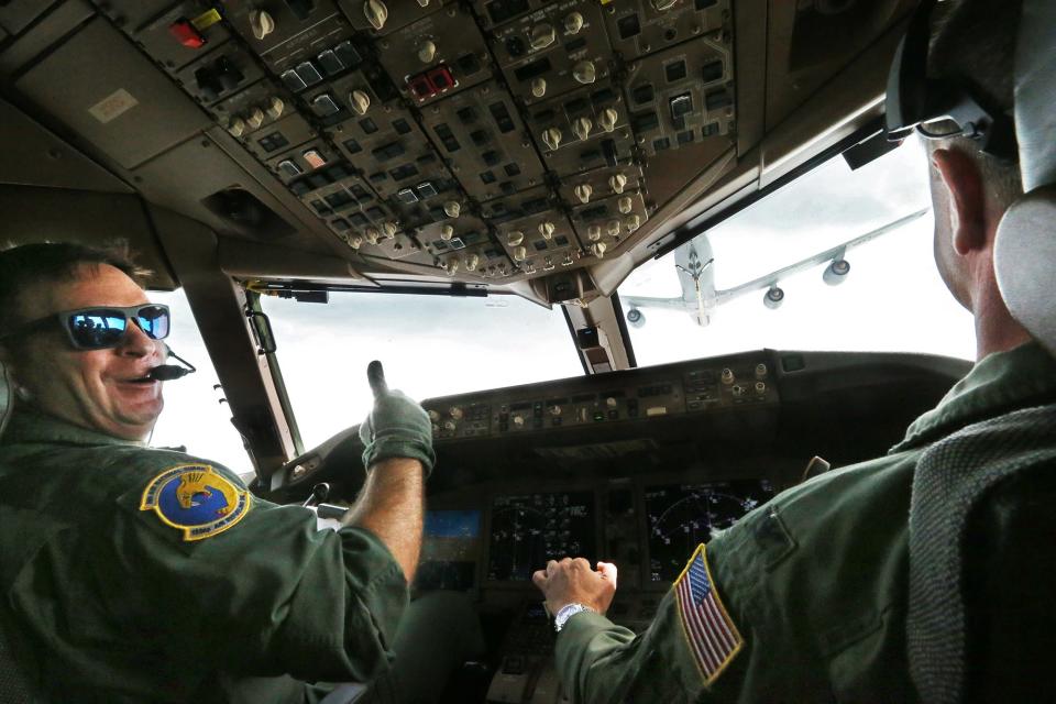 Col. Brian Carloni, commander of the 157th Operations Group, gives a thumbs up after Col. Nelson Perron,  commander of the 157th Air Refueling Wing, makes successful contact with a KC-135 tanker for refueling in the air while flying over New England Tuesday, June 27, 2023.