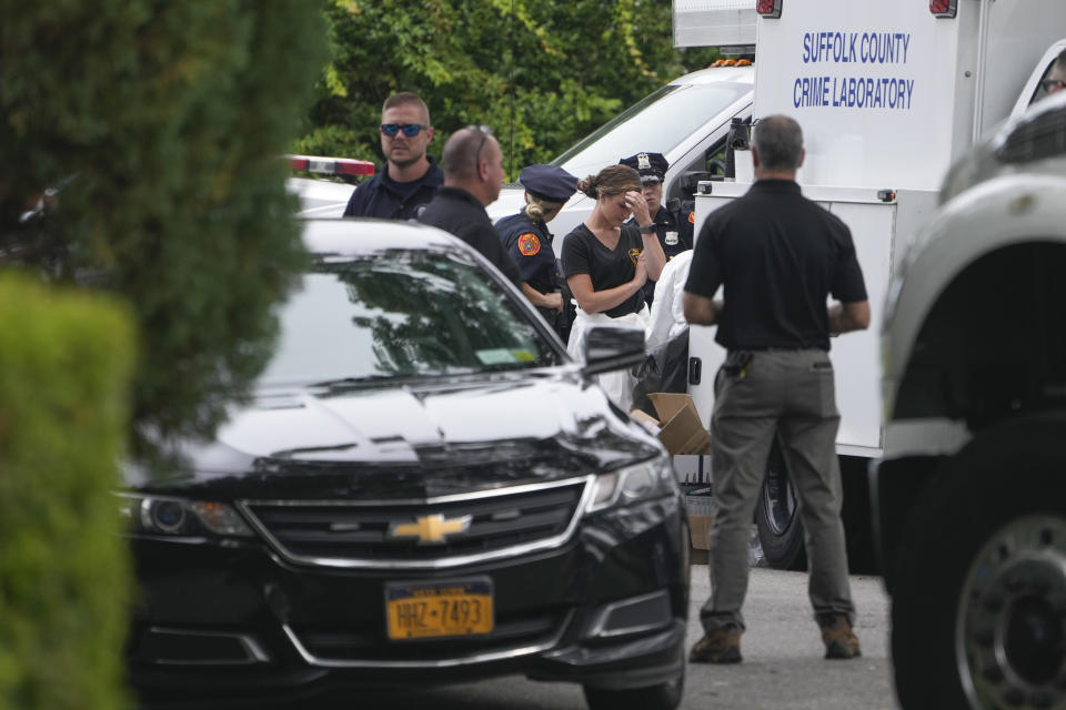 Authorities continue to work at the home of suspect Rex Heuermann in Massapequa Park, N.Y., Monday, July 24, 2023. Heuermann has been charged with killing at least three women in the long-unsolved slayings known as the Gilgo Beach killings. (AP Photo/Seth Wenig)
