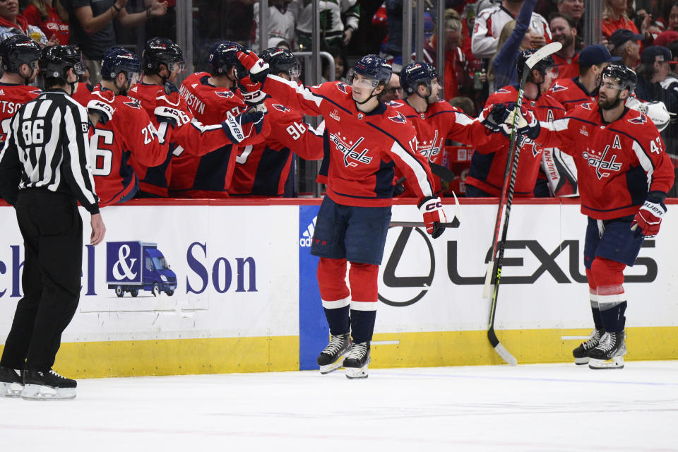 Washington Capitals center Dylan Strome (17) is congratulated for his goal during the second period of the team's NHL hockey game against the Florida Panthers, Saturday, April 8, 2023, in Washington. (AP Photo/Nick Wass)