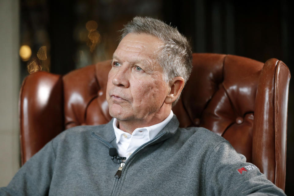 FILE - In a Thursday, Dec. 13, 2018 file photo, Ohio Gov. John Kasich sits for an interview with The Associated Press in Columbus. West Virginia University President Gordon Gee and former Ohio Gov. John Kasich are creating a nonprofit that will fight to steer money from any national opioid settlement to hospitals and health-based research. Gee and Kasich will announce Citizens for Effective Opioid Treatment on Thursday, August 22, 2019. (AP Photo/John Minchillo, File)