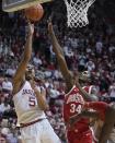 Indiana's Malik Reneau shoots over Ohio State's Felix Okpara (34) during the second half of an NCAA college basketball game, Saturday, Jan. 28, 2023, in Bloomington, Ind. (AP Photo/Darron Cummings)