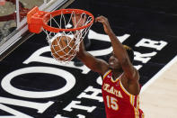 Atlanta Hawks center Clint Capela scores during the first half of the team's NBA basketball game against the Brooklyn Nets on Wednesday, Jan. 27, 2021, in Atlanta. (AP Photo/Brynn Anderson)