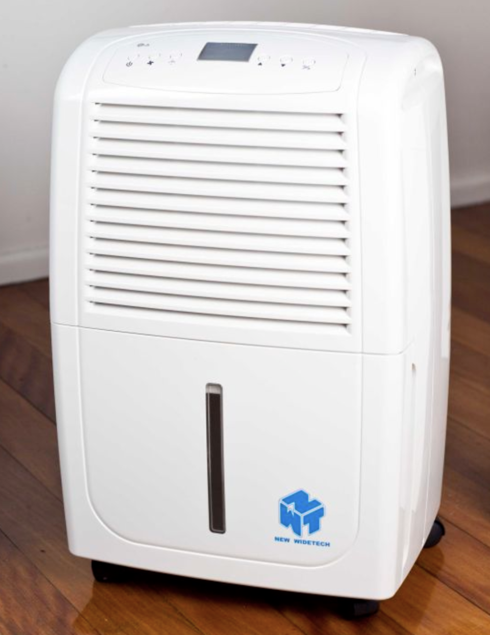 A white Ausclimate NWT Large 35L, $599 sits on polished wooden floorboards near a white wall.