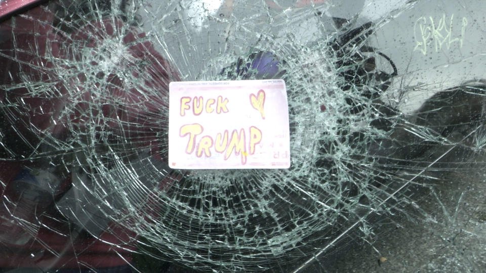 A destroyed car window in downtown Washington of a limo that was later set on fire following the inauguration of President Donald Trump on Jan. 20, 2017. (Photo: Stephen J. Boitano via Getty Images)