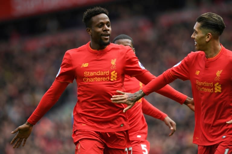 Liverpool's Divock Origi (left) celebrates after scoring his side's third goal in the 3-1 victory over Everton in the Merseyside derby at Anfield on April 1, 2017