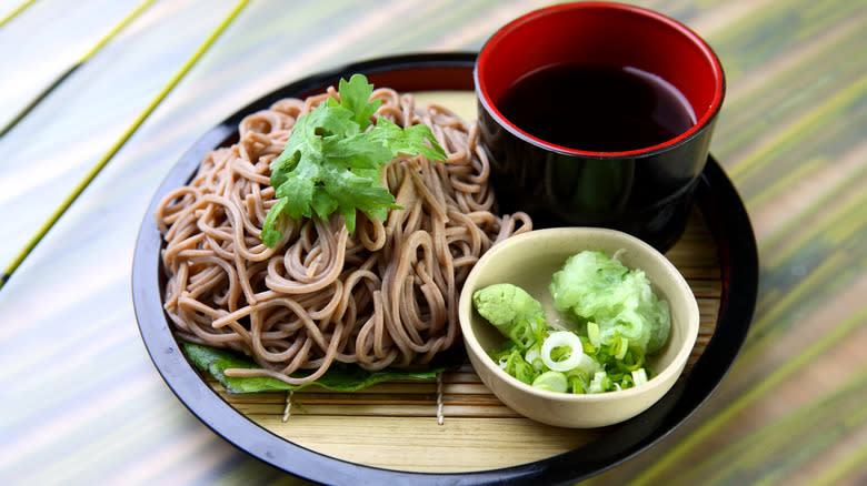 soba pictured with dipping sauce