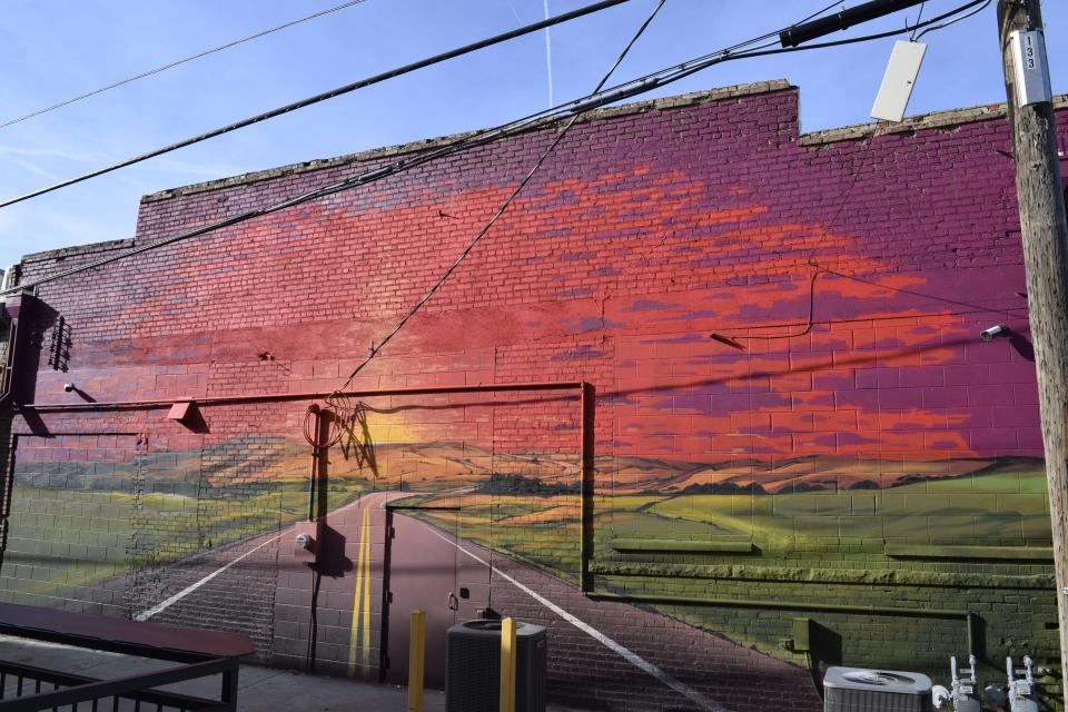 A mural painted by Eric Montoy based on a composite of two photos by Tanner Colvin can be found behind The Garage automobile museum. The mural is one of several that have been commissioned and are being created in downtown Salina over the past few years.