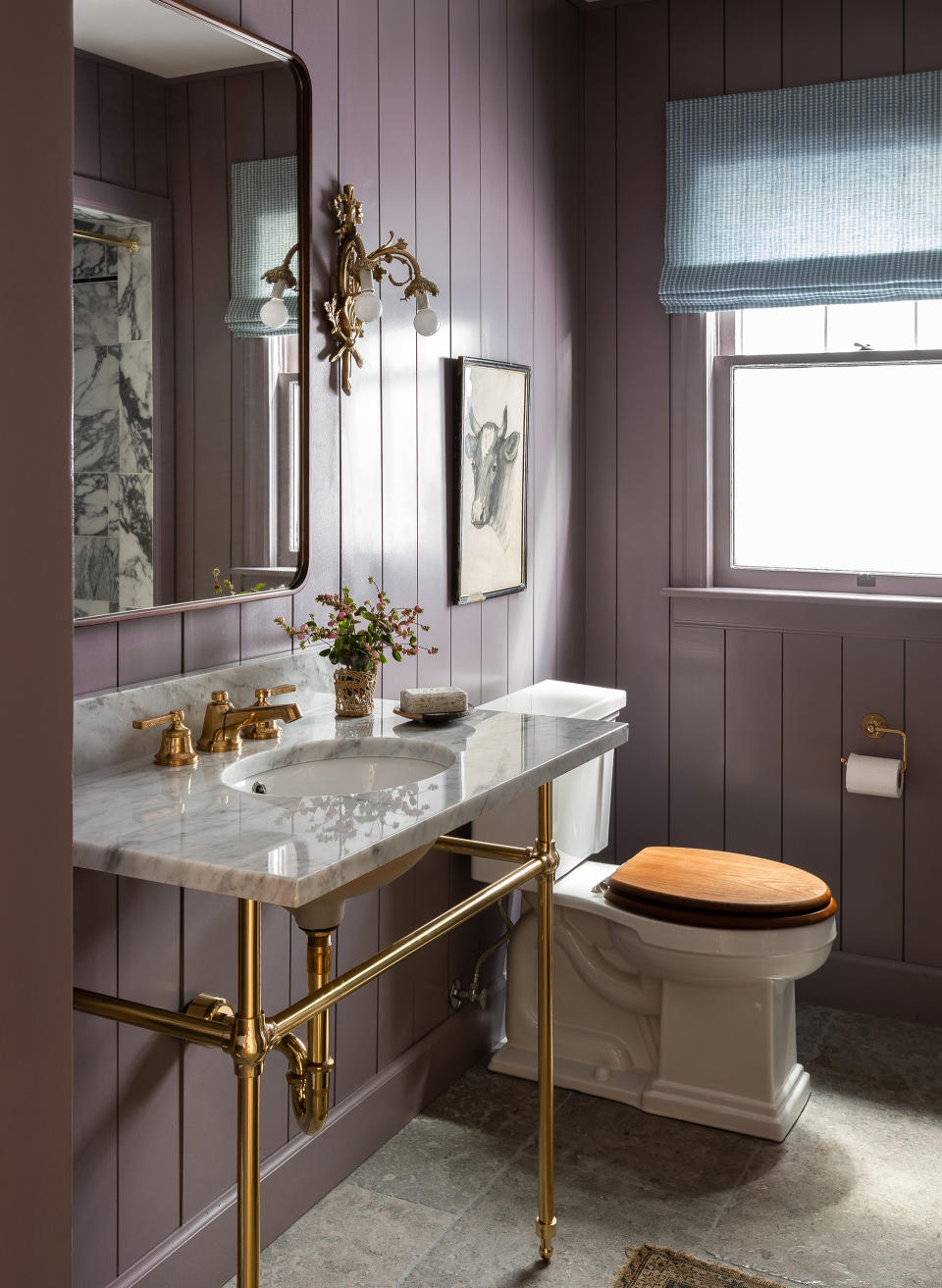 full length purple panels in bathroom with ceramic sink and WC